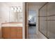 Classic bathroom with a tiled vanity and adjacent tiled shower at 392 Starmine Pl, Castle Rock, CO 80108