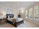 Serene bedroom with plush carpeting, and large window views at 392 Starmine Pl, Castle Rock, CO 80108