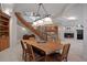 Open dining room with a staircase, fireplace, and custom ceiling at 392 Starmine Pl, Castle Rock, CO 80108