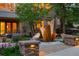 Charming home exterior featuring a unique rock water feature and inviting entryway at 392 Starmine Pl, Castle Rock, CO 80108