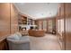 Spacious home office features wood paneled walls, custom built-ins and natural light at 392 Starmine Pl, Castle Rock, CO 80108