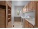 Functional laundry room with ample storage, counter space, washer, and dryer at 392 Starmine Pl, Castle Rock, CO 80108