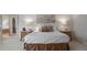 Comfortable primary bedroom with a plush bed, soft lighting, and ensuite bathroom access at 392 Starmine Pl, Castle Rock, CO 80108