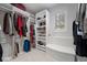 Custom walk-in closet with built-in shelving and ample storage at 392 Starmine Pl, Castle Rock, CO 80108