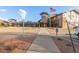 Community building with American flag has stone and wood elements, set on a circular drive with landscaped frontage at 14091 E Marina Dr # 308, Aurora, CO 80014