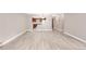 Spacious living area featuring wood-look floors and neutral wall color throughout at 14091 E Marina Dr # 308, Aurora, CO 80014