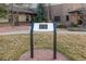 Community welcome sign surrounded by landscaped grounds and mature trees shows unit number 2888 at 14091 E Marina Dr # 308, Aurora, CO 80014