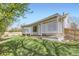 View of the backyard and covered patio featuring a privacy lattice screen at 13515 Milwaukee Ct, Thornton, CO 80241