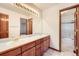 Bathroom featuring a double sink vanity and a shower and bathtub combination at 13515 Milwaukee Ct, Thornton, CO 80241