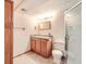 Bathroom featuring a single sink vanity and a glass enclosed shower at 13515 Milwaukee Ct, Thornton, CO 80241