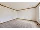 Neutral carpeted bedroom with white walls and wood trim offers a serene and versatile space at 13515 Milwaukee Ct, Thornton, CO 80241