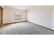 Bedroom with neutral carpet, a large window, and trim at 13515 Milwaukee Ct, Thornton, CO 80241