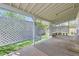 Covered patio with lattice screen, concrete flooring, and seating area at 13515 Milwaukee Ct, Thornton, CO 80241