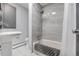 Bathroom features tiled walls, bathtub and a vessel sink at 2831 & 2833 Reed St, Wheat Ridge, CO 80033