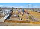Aerial view of the property showcasing the backyard, pool, and surrounding landscape at 3948 S Halifax St, Aurora, CO 80013