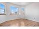 This bedroom has windows and laminate floors at 3948 S Halifax St, Aurora, CO 80013