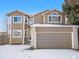 Charming two-story home featuring a brick accent, arched window and an attached two car garage in a quiet neighborhood at 3948 S Halifax St, Aurora, CO 80013