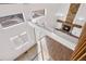 Unique view from the upper level features a stone fireplace, an open floor plan, and new flooring and paint at 3948 S Halifax St, Aurora, CO 80013