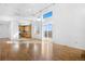 Bright open-concept home with high ceilings, sleek flooring, and access to a balcony through sliding glass doors at 3948 S Halifax St, Aurora, CO 80013