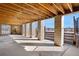 Covered patio with wood ceiling and stone pillars at 3948 S Halifax St, Aurora, CO 80013
