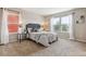 Comfortable bedroom features neutral tones, plush carpet, and bright natural light at 2857 Xanthia Ct, Denver, CO 80238