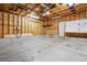Spacious garage with ample room for vehicles and storage, includes an EV charger at 2857 Xanthia Ct, Denver, CO 80238
