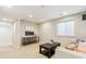 Cozy living area with neutral tones, recessed lighting, and a bright window at 2857 Xanthia Ct, Denver, CO 80238