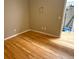 Empty bedroom with hardwood floors, neutral paint, and natural lighting at 1555 California St # 609, Denver, CO 80202