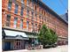 Beautiful brick building with an awning covered entrance, an urban residential and retail space at 1555 California St # 609, Denver, CO 80202