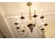 Elegant chandelier fixture with candle-style lights adding a touch of sophistication at 1555 California St # 609, Denver, CO 80202