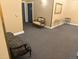 A neutral toned hallway with furniture placed throughout, artwork is on the wall at 1555 California St # 609, Denver, CO 80202