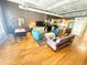 Spacious living room area offering an open floor plan with a view of kitchen and dining area at 1555 California St # 609, Denver, CO 80202