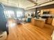 Spacious living room and kitchen with stainless steel appliances and hardwood floors at 1555 California St # 609, Denver, CO 80202