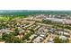 Aerial view of home in a leafy neighborhood near a golf course with downtown in the background, highlighting prime location at 2821 E Cedar Ave # 14, Denver, CO 80209