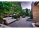 Serene backyard with lush landscaping, inviting seating, and ambient lighting, creating a tranquil outdoor retreat at 2821 E Cedar Ave # 14, Denver, CO 80209