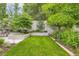 Lush backyard featuring manicured lawn and mature trees, offering a private outdoor space for relaxation and recreation at 2821 E Cedar Ave # 14, Denver, CO 80209
