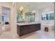 Bathroom featuring floating vanity with marble countertops and and sink at 2821 E Cedar Ave # 14, Denver, CO 80209