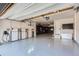 Spacious garage featuring Tesla power wall battery system and ample storage, perfect for car enthusiasts and organization at 2821 E Cedar Ave # 14, Denver, CO 80209