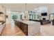 Open concept kitchen with marble island, wine fridge, and seamless flow into the living area at 2821 E Cedar Ave # 14, Denver, CO 80209