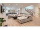 Spacious living room features contemporary sectional sofa and modern lighting at 2821 E Cedar Ave # 14, Denver, CO 80209