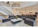 Open living space with high ceilings and a staircase with iron railing at 2821 E Cedar Ave # 14, Denver, CO 80209