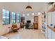 Office with a light fixture, large windows, and wooden shelving at 2821 E Cedar Ave # 14, Denver, CO 80209