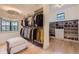 Spacious walk-in closet with custom shelving for clothing and shoes at 2821 E Cedar Ave # 14, Denver, CO 80209