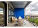 Cozy outdoor balcony featuring comfortable seating with a view at 3198 Blake St # 402, Denver, CO 80205