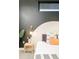 Stylish bedroom featuring a modern aesthetic, designer lighting, and a striking two-tone wall design at 3198 Blake St # 402, Denver, CO 80205