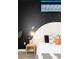 Bedroom close up of a chic headboard and modern wall sconce at 3198 Blake St # 402, Denver, CO 80205