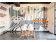 A modern dining area featuring a graffiti wall, table, and chairs for a unique and artistic space at 3198 Blake St # 402, Denver, CO 80205
