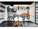 Stylish dining area featuring a unique mural wall, modern table, and comfortable seating at 3198 Blake St # 402, Denver, CO 80205
