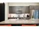Granite countertops and stainless steel appliances stand out in the contemporary kitchen at 3198 Blake St # 402, Denver, CO 80205
