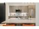 Modern kitchen with stainless steel appliances, granite countertops, and ample cabinet space at 3198 Blake St # 402, Denver, CO 80205